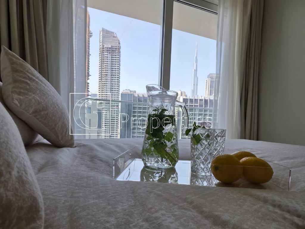 Fully Furnished | Pool and Burj View | High Floor - 8