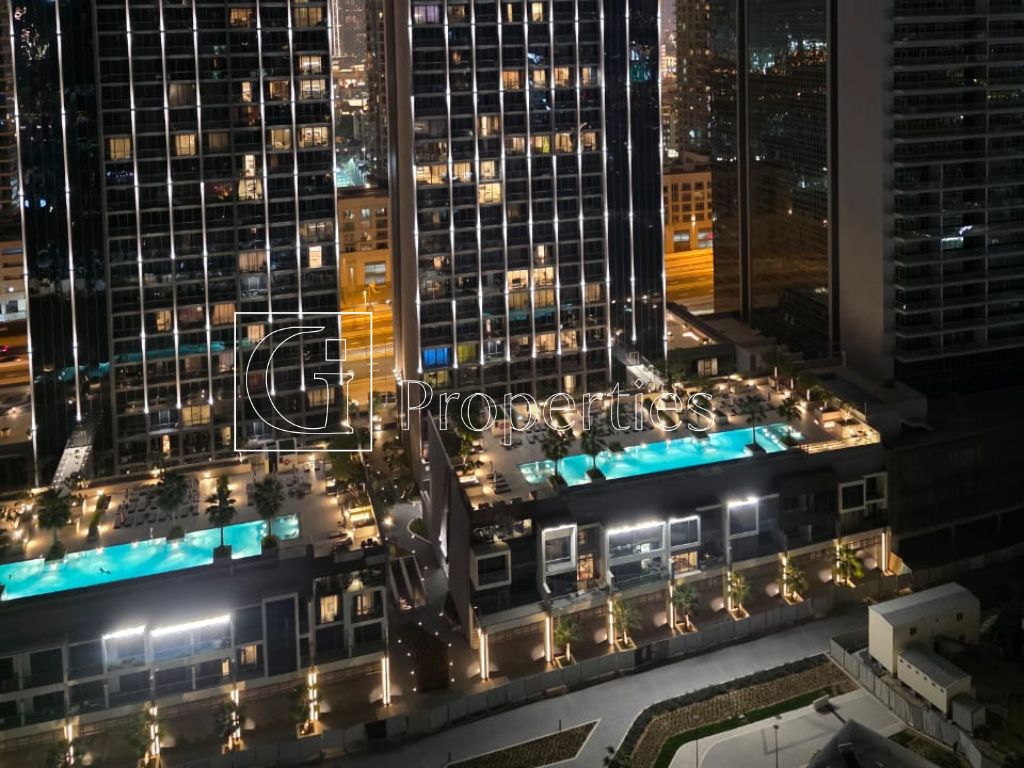 Fully Furnished | Pool and Burj View | High Floor - 12